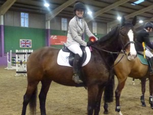Katie King and Colonel Gun- winners of the Senior Intermediate SJ at the NIRC Indoor Championships