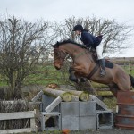 Emma Louise Murray on Paddy in flight over the gallop logs