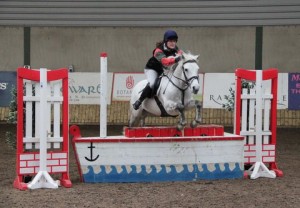 Working hunter specialist, Toni Donnelly, seen here jumping the joker fence in the 85cm class on board Sam, gets her season off to a flying start at Ravensdale Lodge on Saturday. The combination going clear in the 85cm class at the centres indoor arena eventing league. Photo: Niall Connolly.