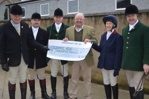 Mr Rex Humphries receiving cheque for £1000 from Route Hunt for RDA Coleraine