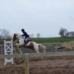Rosemary Moffett on The Garvy clearing the gallop fence