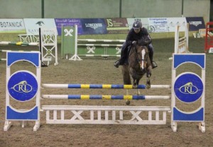 Amy Mc Verry & Ted in action over the 1.10m track at Ravensdale Lodge's indoor horse & pony training league on Friday night. Photo: Niall Connolly.