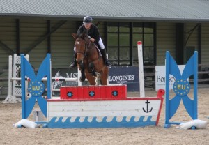 Matthew Johnson & Oscar clear the joker fence in the 1m class on Saturday afternoon at Ravensdale Lodge's spring / summer outdoor arena eventing league.  Photo: Niall Connolly.