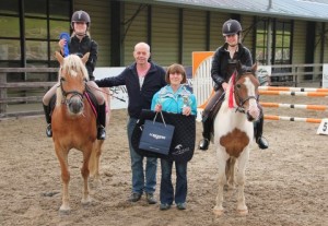 "Sister act & family affair": Sisters Cara Mc Donald, winner of the 80cm league and final & Gina Mc Donald, second in both the 80cm league and final are joined by proud parents Des & Giovanna at Ravensdale Lodge's horse & pony training league final on Friday evening. Photo: Niall Connolly. 