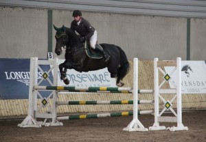 "High jump": Last Minute Van Overis displays his potential under Tom Hearne as the combination go clear in the 1.10m class at Ravensdale Lodge's SJI registered indoor horse league on Thursday afternoon. Photo: Niall Connolly.